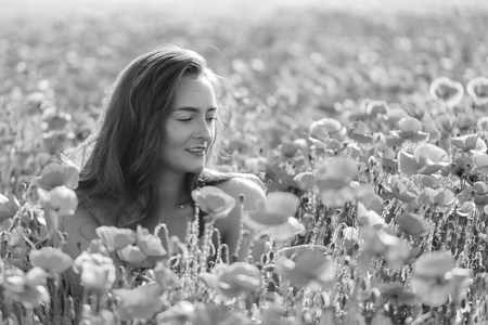 Portrait of a girl in the poppy fieldの写真素材