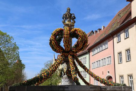 Easter eggs on a fountain in the city.の写真素材