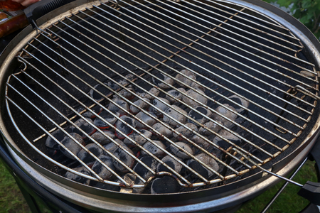 Kindling of fire for cooking on a grill.の写真素材