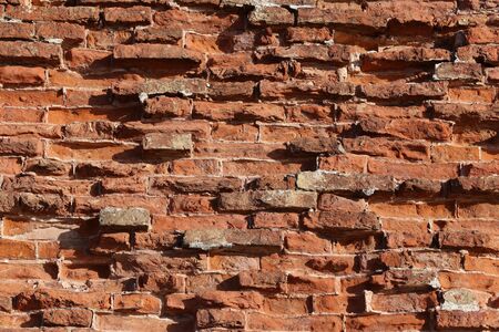 The old red brick fortress wall is crumbling.