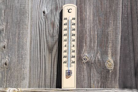 Thermometer shows high temperatures of hot summer.