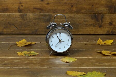 Autumn still life with an old alarm clock.の写真素材