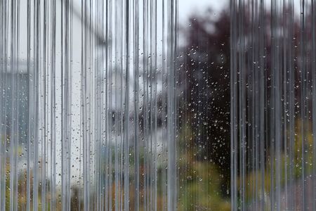 Background. It s raining outside the window - There are drops of water on the windows