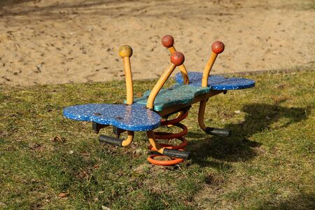 Rocking chair for children in the playground.