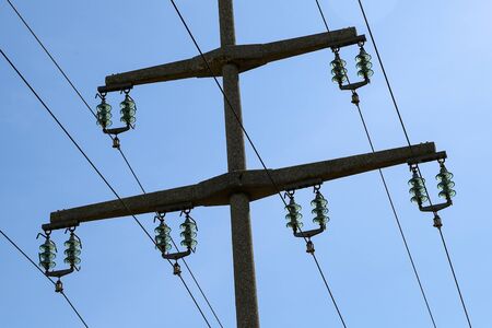 Transmission line on background of blue sky.