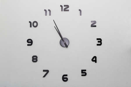 Large modern clock on a whole wall in the houseの写真素材