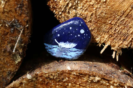 The painted hiking stone is left on the walking path for passersby to see.の写真素材