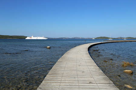 Wooden path to the island to the fortress of St. Nicholas, Croatia.の写真素材