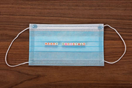 A face mask that says - Merry Christmas.