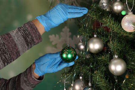 Decorate Christmas tree in corona virus times.