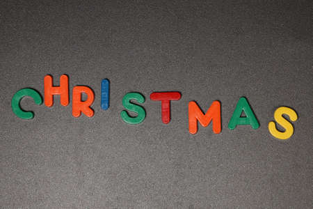 CHRISTMAS - Christmas still life with multicolored plastic lettersの写真素材