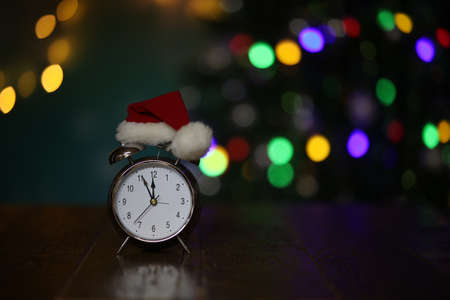 New year composition with alarm clock and beautiful bokeh in the background.の写真素材