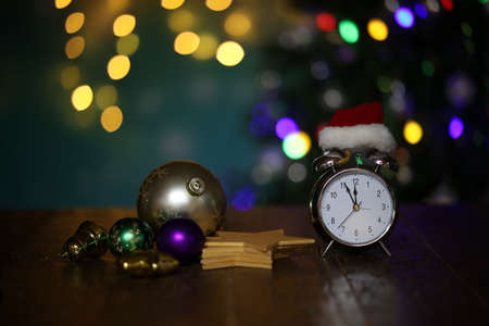 New year composition with alarm clock and beautiful bokeh in the background.の写真素材