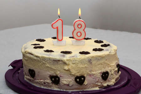 An image of a birthday cake with candle - 18.の写真素材