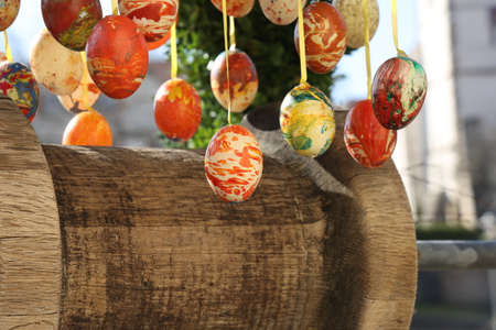 Colored decorative eggs are used to decorate wells in Germany for Easter.の写真素材
