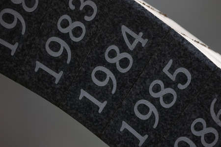 Years engraved on a monument and painted with white paint.
