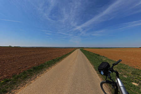 Spring landscape with an e-bike on the way.の写真素材