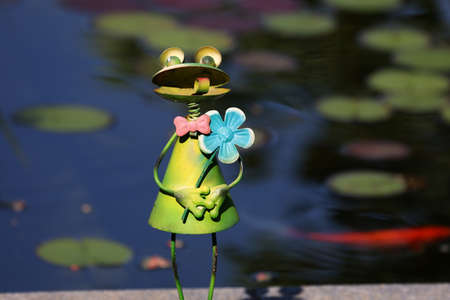 Decorative frog in the garden by the pond.の写真素材
