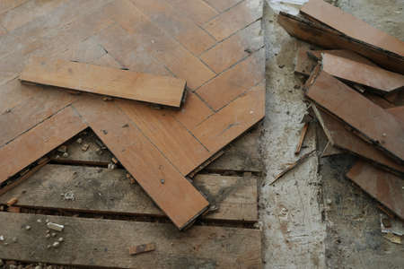 The old parquet floor is dismantled and a new one will be installed.の写真素材