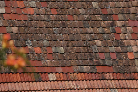 Old shingles on the roof of the house.の写真素材
