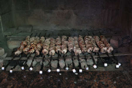 Pork kebabs are fried on the grill.の写真素材