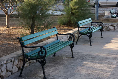 Bench in the park. Wooden bench for rest.の写真素材