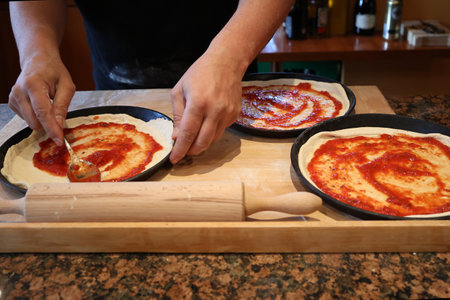 Bake original Italian pizza at home - Traditional preparation.の写真素材