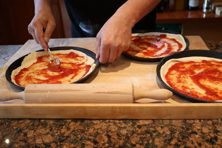 Bake original Italian pizza at home - Traditional preparation.の写真素材