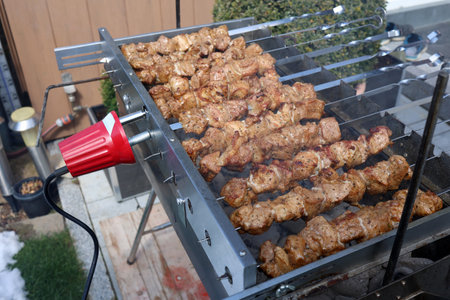 Roasted meat cooked at barbecue with smoke.の写真素材