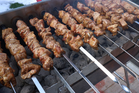 Roasted meat cooked at barbecue with smoke.の写真素材