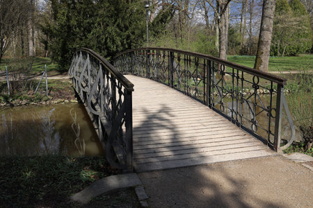 Beautiful bridge across the river in the city park.の写真素材