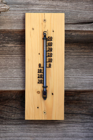 Thermometer shows high temperature on a hot day.の写真素材