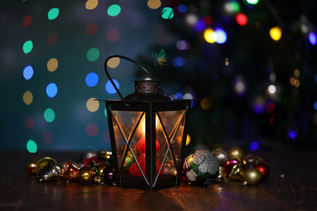 Christmas. A beautiful lantern on a background of colored lights.の写真素材