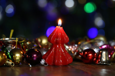 Burning decorative candle on christmas backgroundの写真素材