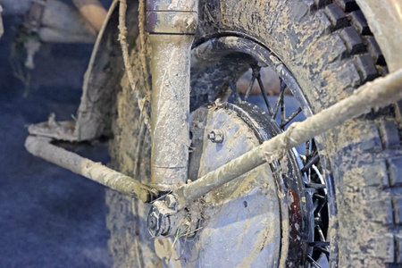 Wheel of an old motorcycle in the mudの写真素材