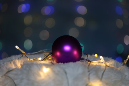 Purple christmas ball on beautiful bokeh background