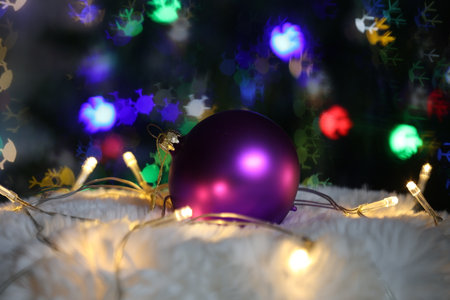 Purple christmas ball on beautiful bokeh backgroundの写真素材
