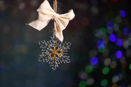 Snowflake figurine on a Christmas treeの写真素材