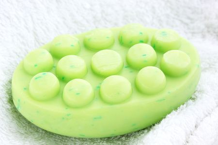 green anticellulite soap on the white towelの写真素材