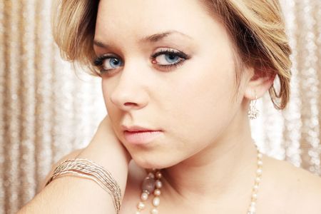 Beautiful tender young woman in the adornmentsの写真素材