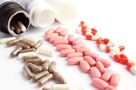 Open jars with the capsules and the tabletsの写真素材
