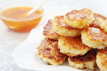 Pancakes with the cottage cheese are fried in deep-fryの写真素材