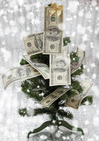 new-year fir tree is decorated with the dollarsの写真素材