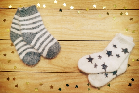 Christmas still life warm socks on a wooden boardの写真素材