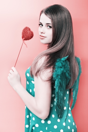  woman with angel wings on a red backgroundの写真素材