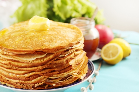pile of thin pancakes on a plateの写真素材