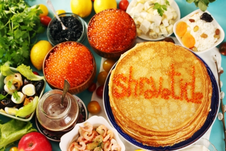 large stack of pancakes with different fillingsの写真素材