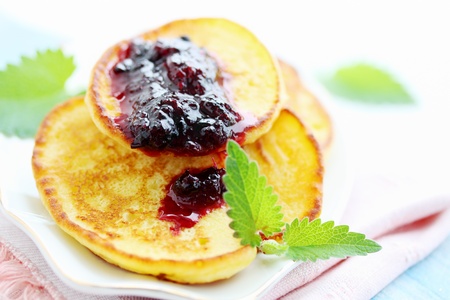 pancakes with mint and black currant jamの写真素材