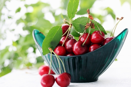 Ripe juicy berries cherries in a bowlの写真素材