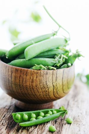 young fresh juicy pods of green peasの写真素材